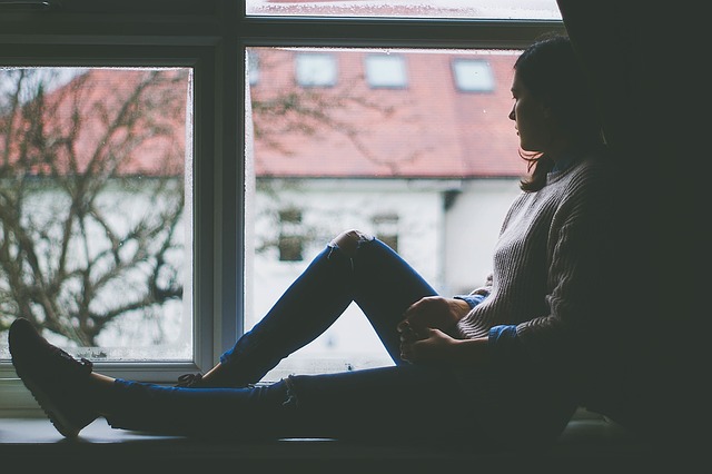 Depression girl in window